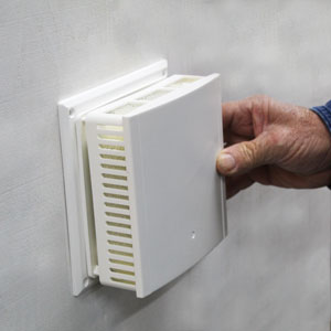 Place noise insulated ventilator top over cover place and pop into place